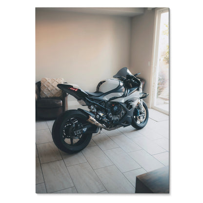 BMW S1000RR motorcycle poster showcasing sleek black and white bike in indoor setting wall art.