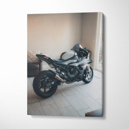 BMW S1000RR motorcycle canvas art in sleek black, vertical wall art with soft natural light and modern interior backdrop.