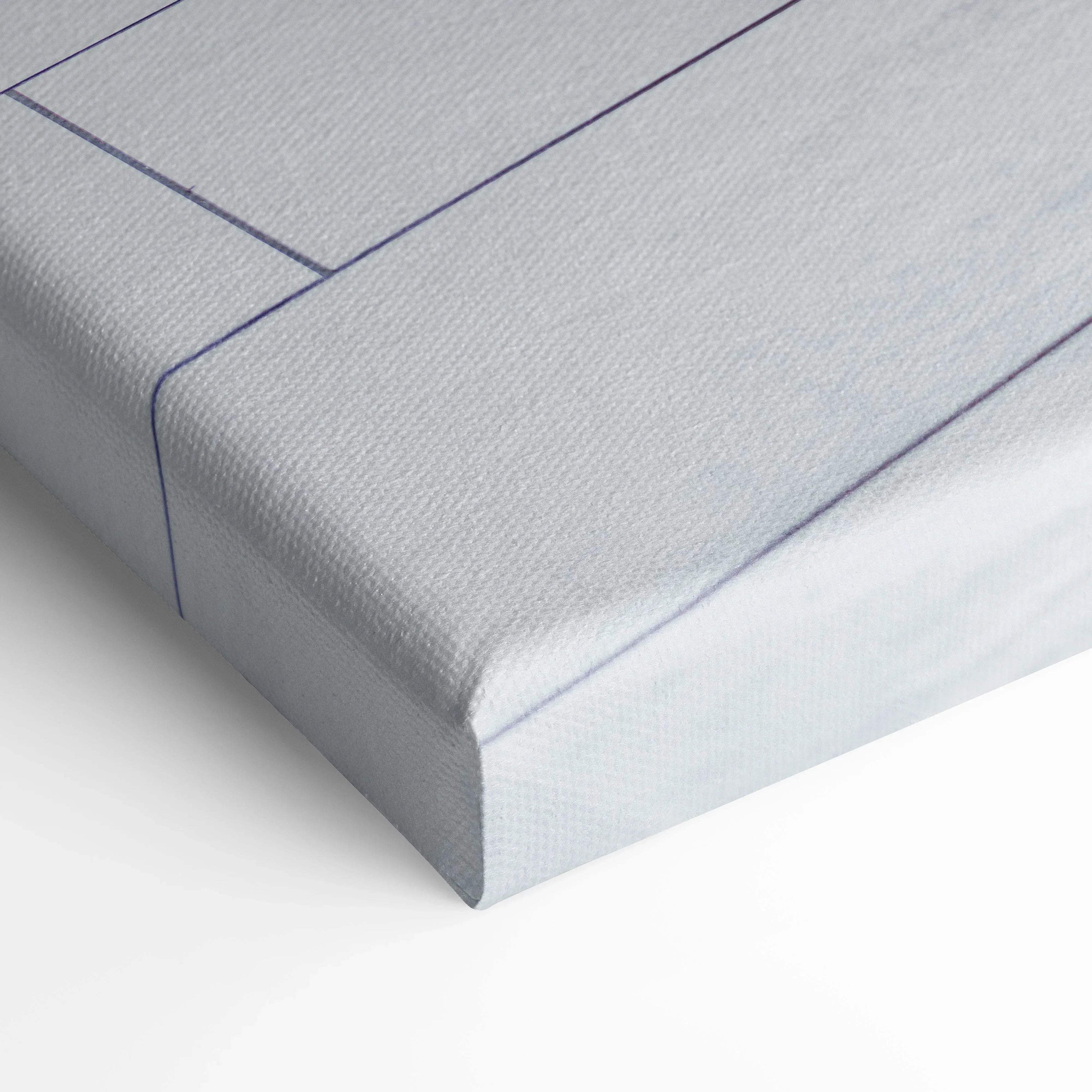 Close-up of textured vertical canvas wall art with detailed corner stitching and clean white surface.