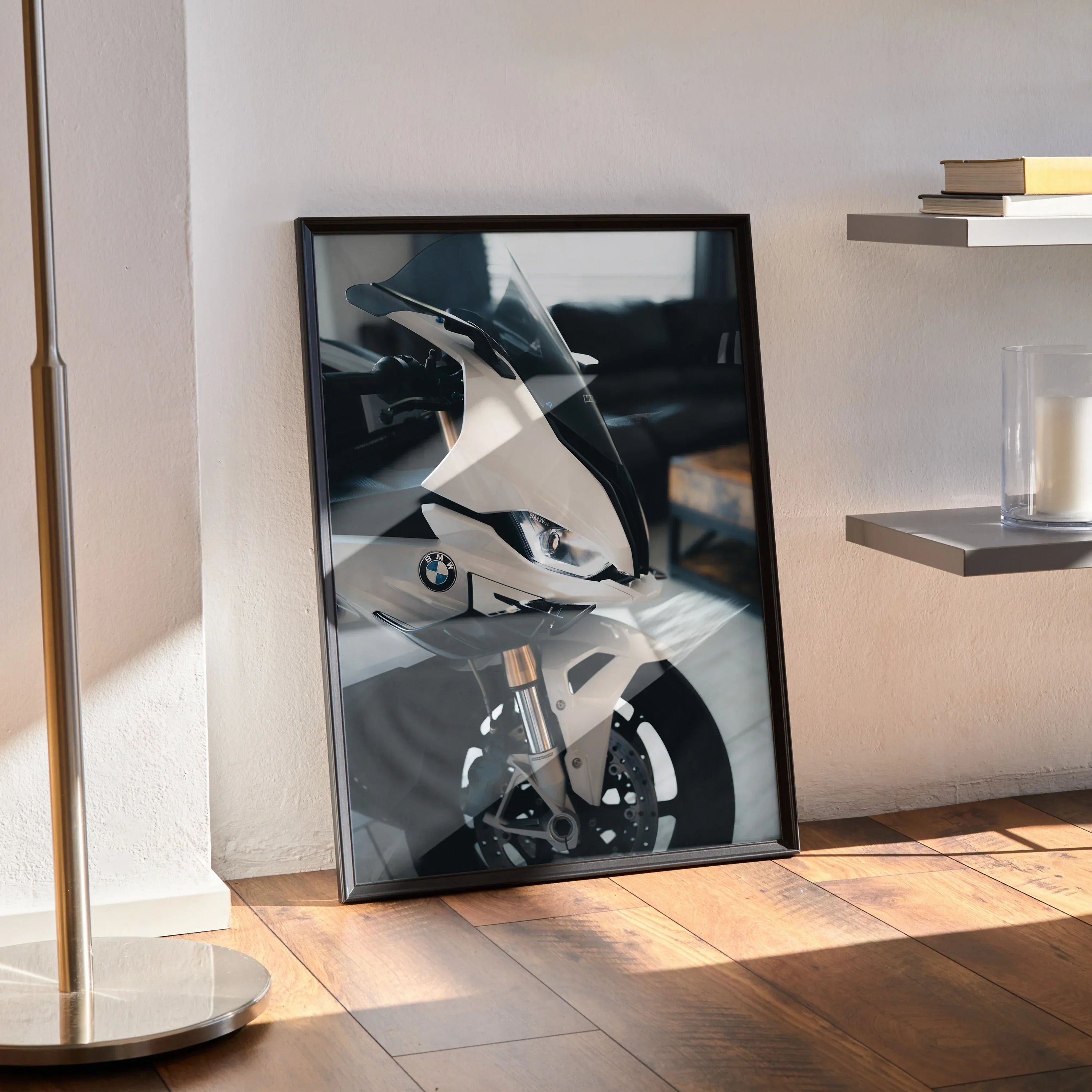 BMW S1000RR motorcycle poster in black frame leaning against wall, modern wall art.