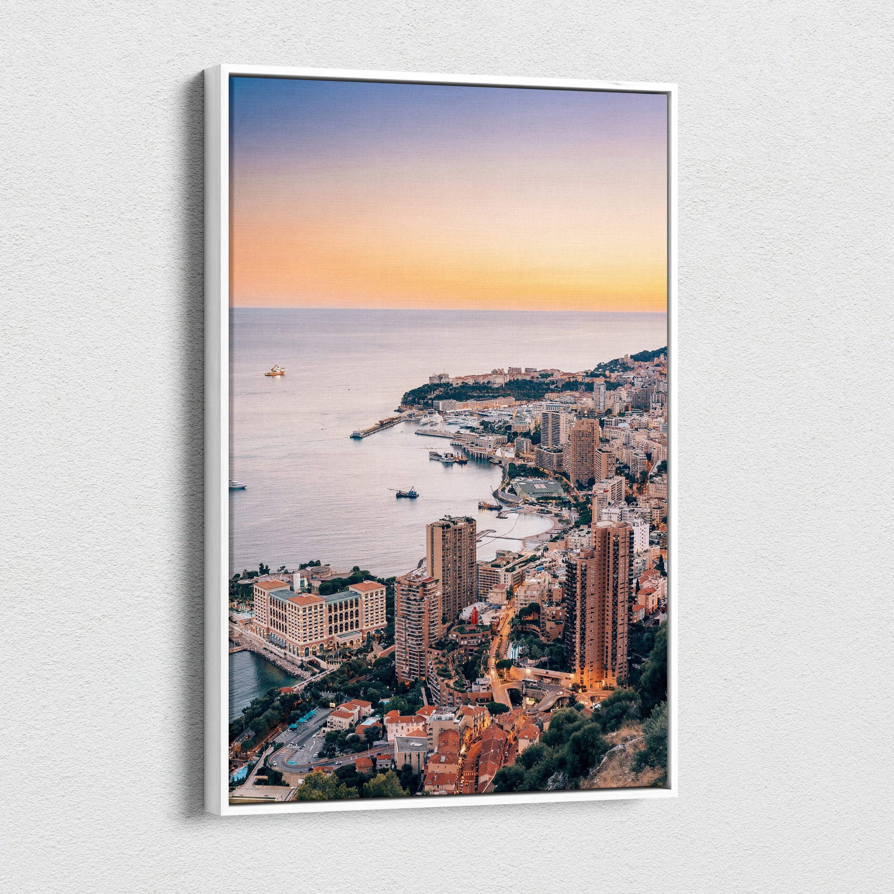 Vertical canvas wall art of a coastal cityscape at sunset with high-rise buildings and calm sea.