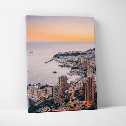 Vertical canvas wall art featuring a high-resolution digital cityscape by the coast at sunset.