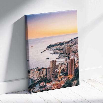 Canvas wall art featuring a high-resolution digital cityscape at sunset with modern buildings and a calm ocean.