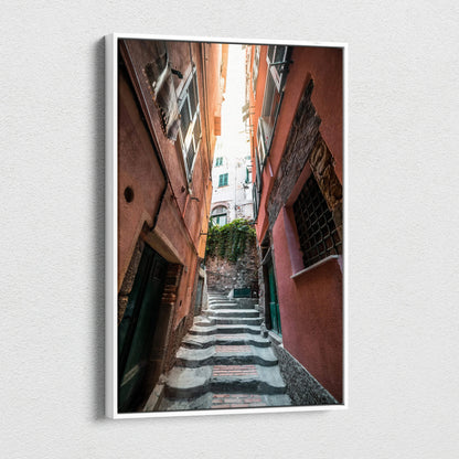 Vertical canvas art print depicting narrow stone steps flanked by tall, weathered buildings in warm tones with architectural