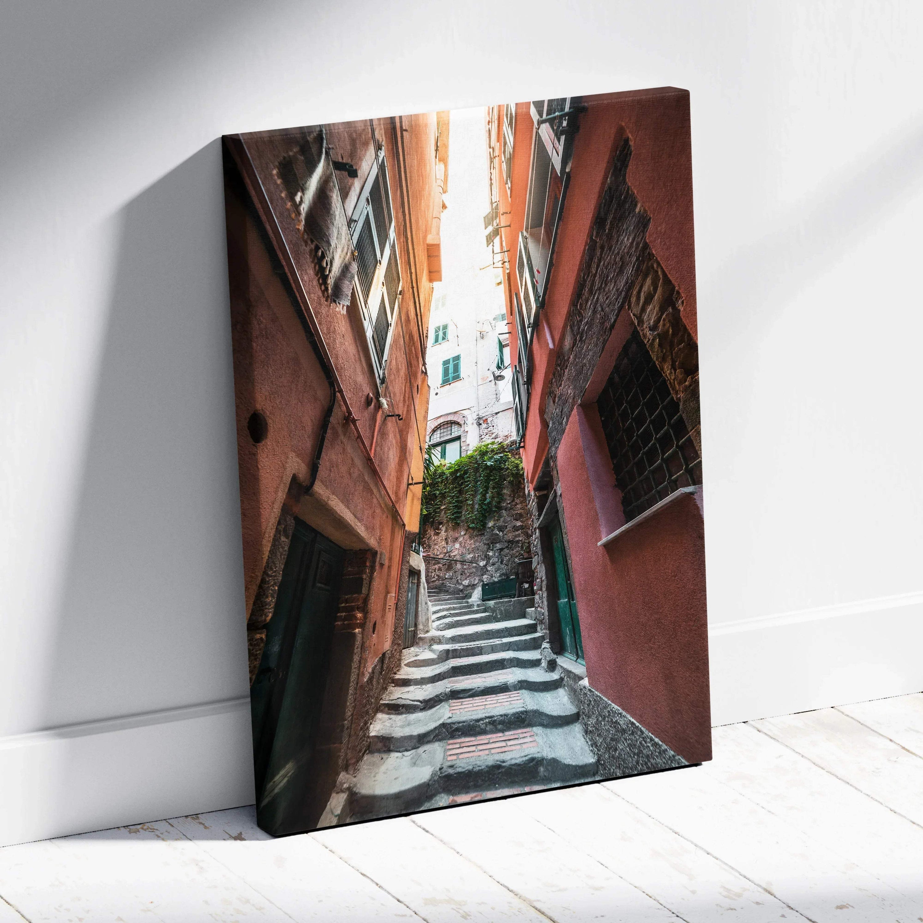 Vertical canvas art depicting a narrow sunlit alley with textured buildings and stairs, urban wall art.