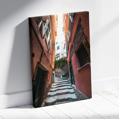 Vertical canvas art depicting a narrow sunlit alley with textured buildings and stairs, urban wall art.
