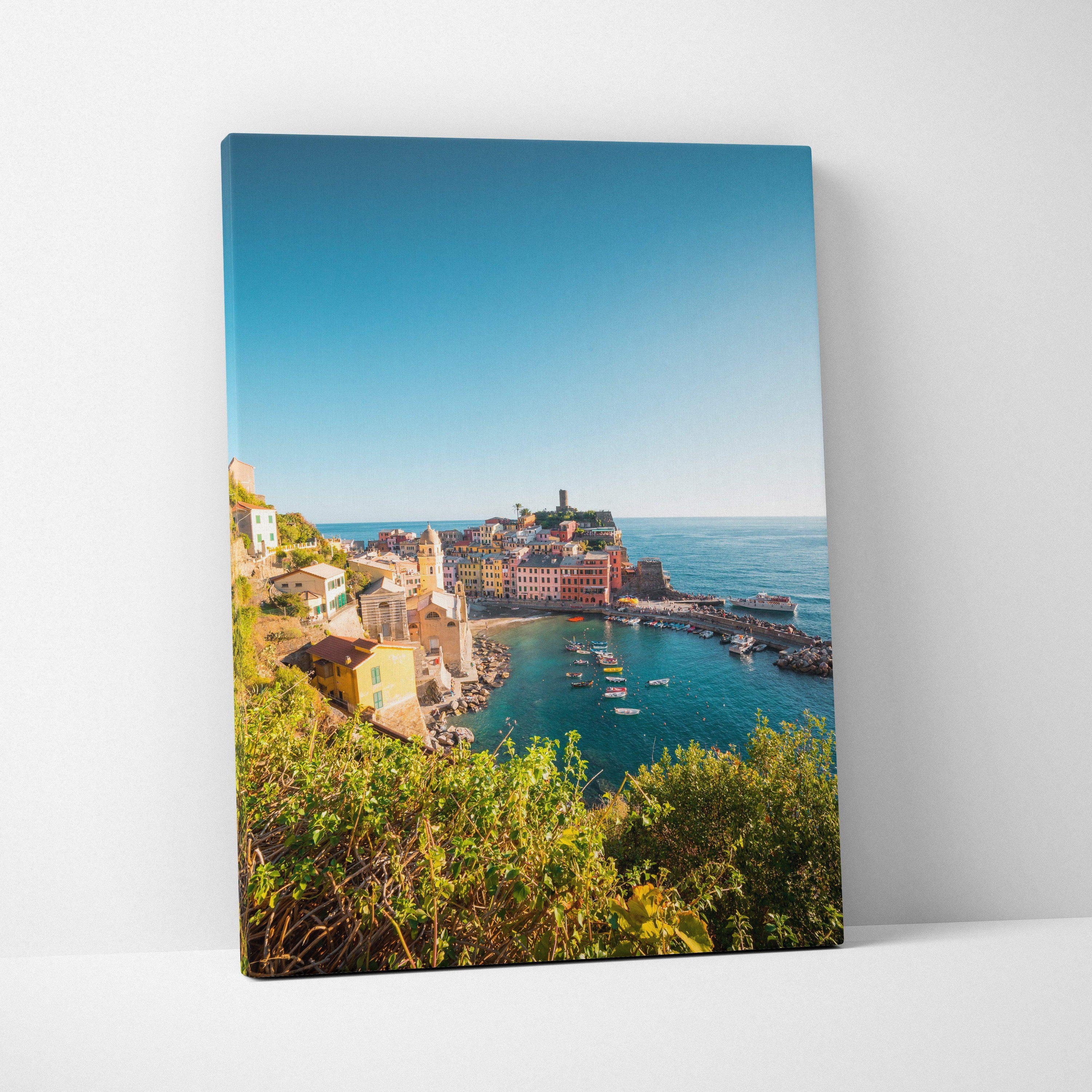 Canvas wall art featuring vibrant coastal architecture with colorful buildings overlooking a calm blue sea under a clear sky.