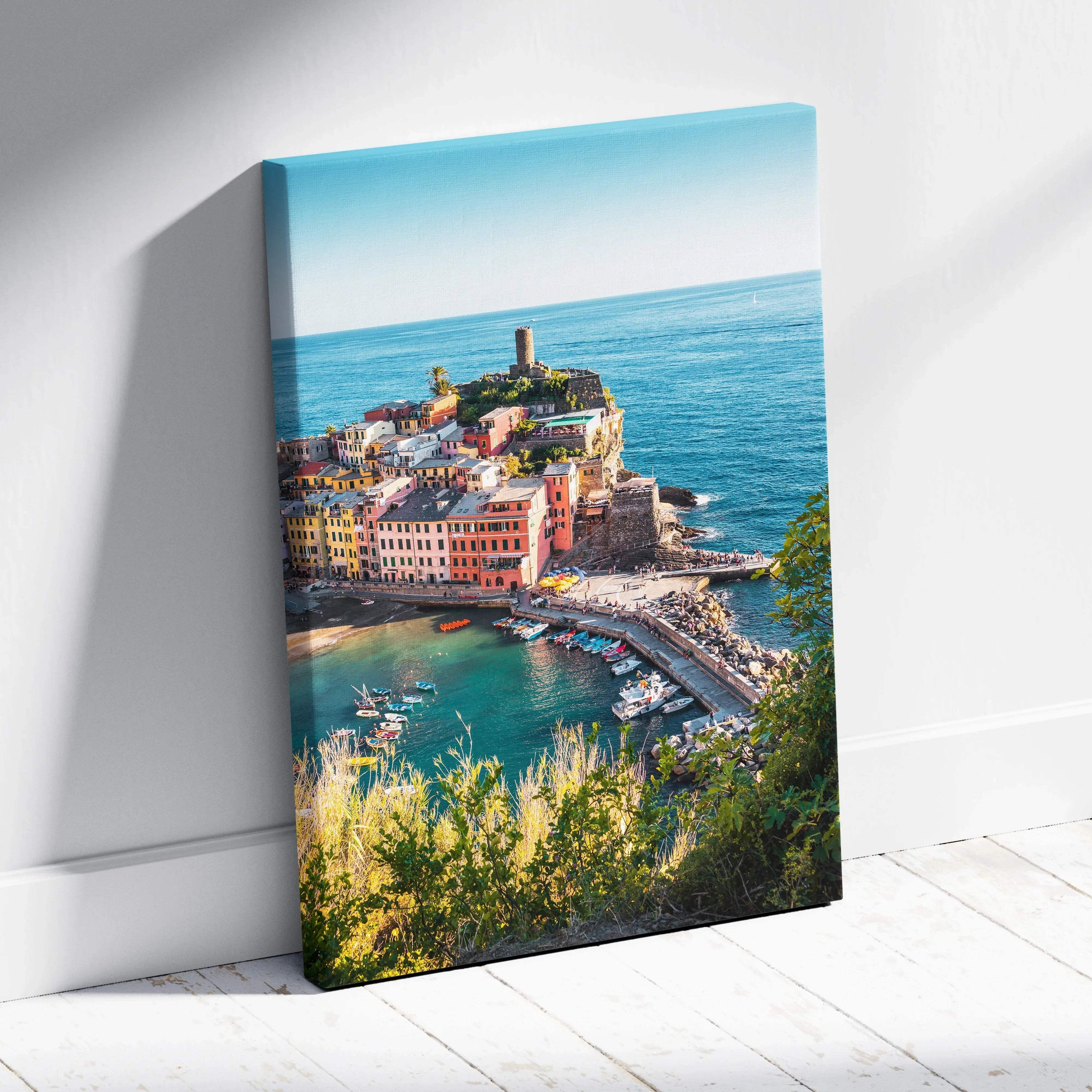 Canvas wall art print featuring colorful coastal buildings with a lighthouse and vibrant blue sea background.