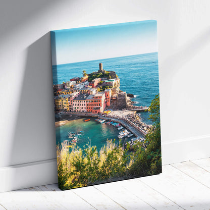 Canvas wall art print featuring colorful coastal buildings with a lighthouse and vibrant blue sea background.