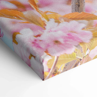 Vibrant pink flower canvas wall art with soft yellow and green foliage decor on 1.5" thick frame.