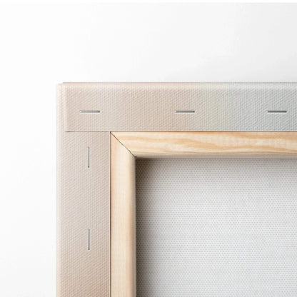 Close-up of natural wood frame with beige canvas stretched and stapled for wall art decor.