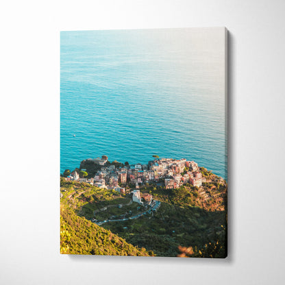 Vertical canvas art featuring coastal architecture and ocean views with vibrant blue water and green hillside.