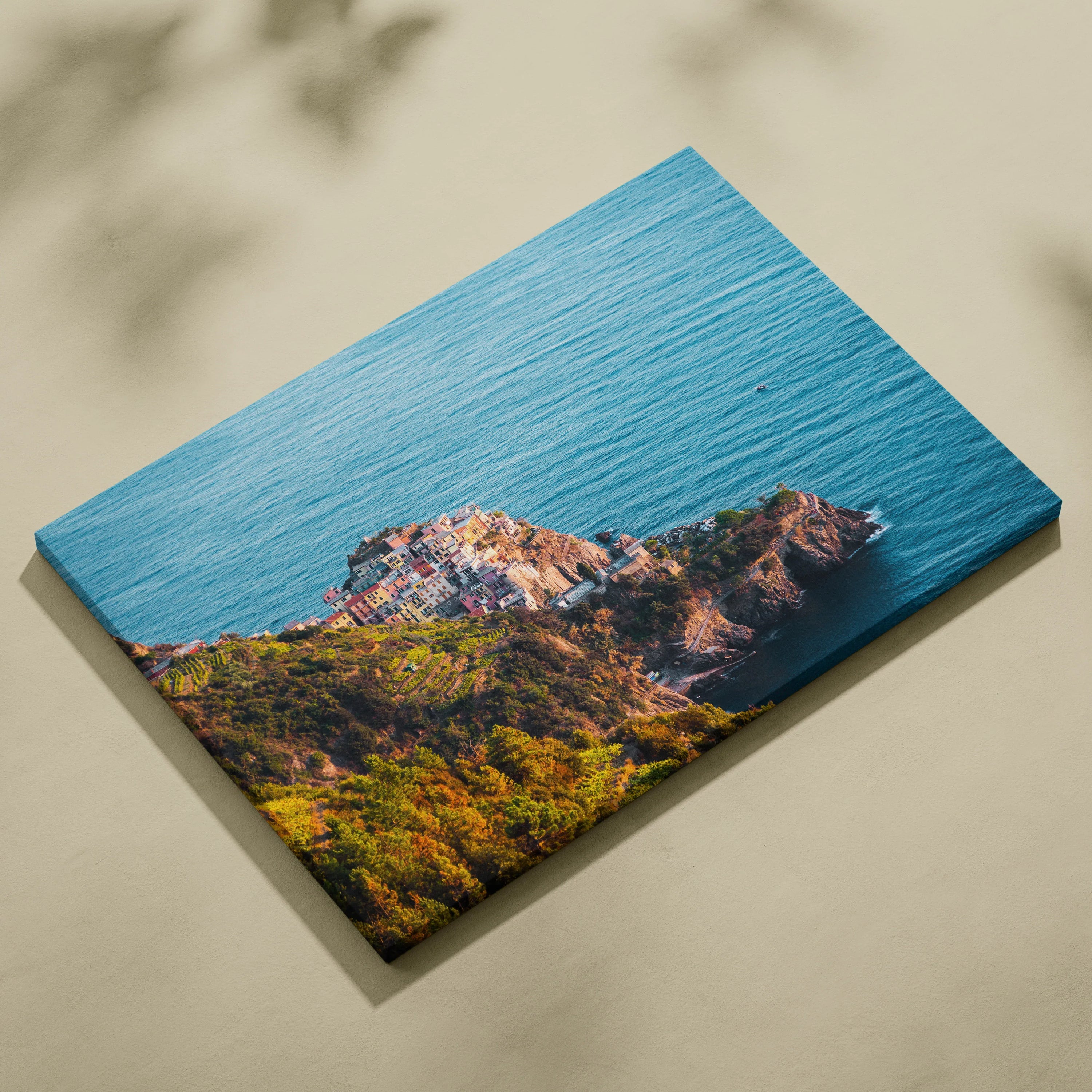 Ocean-themed architecture canvas wall art featuring a coastal landscape with blue water and rocky cliffs.