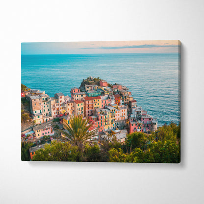 Colorful coastal village architecture against vibrant ocean backdrop on canvas wall art.