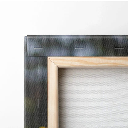 Close-up of wooden frame and black canvas edge with visible staples on wall art decor.