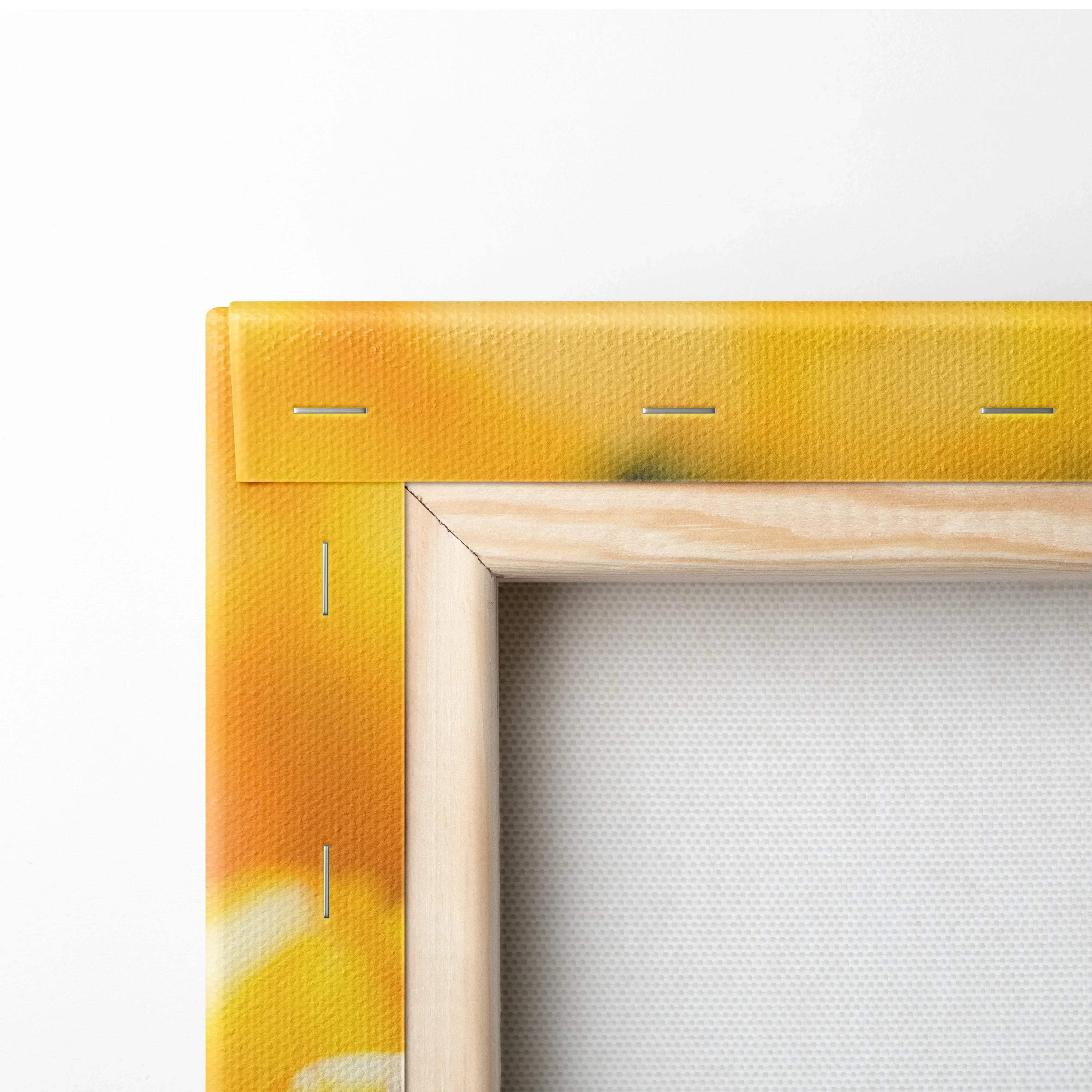 Close-up of vibrant yellow tulips canvas print corner with natural wood frame, wall art decor detail.