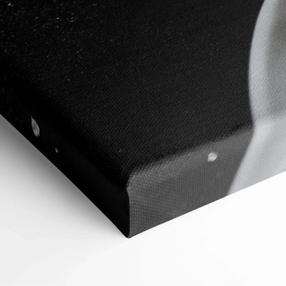 Close-up of black canvas wrap with white detail on gallery-wrapped wall art print.