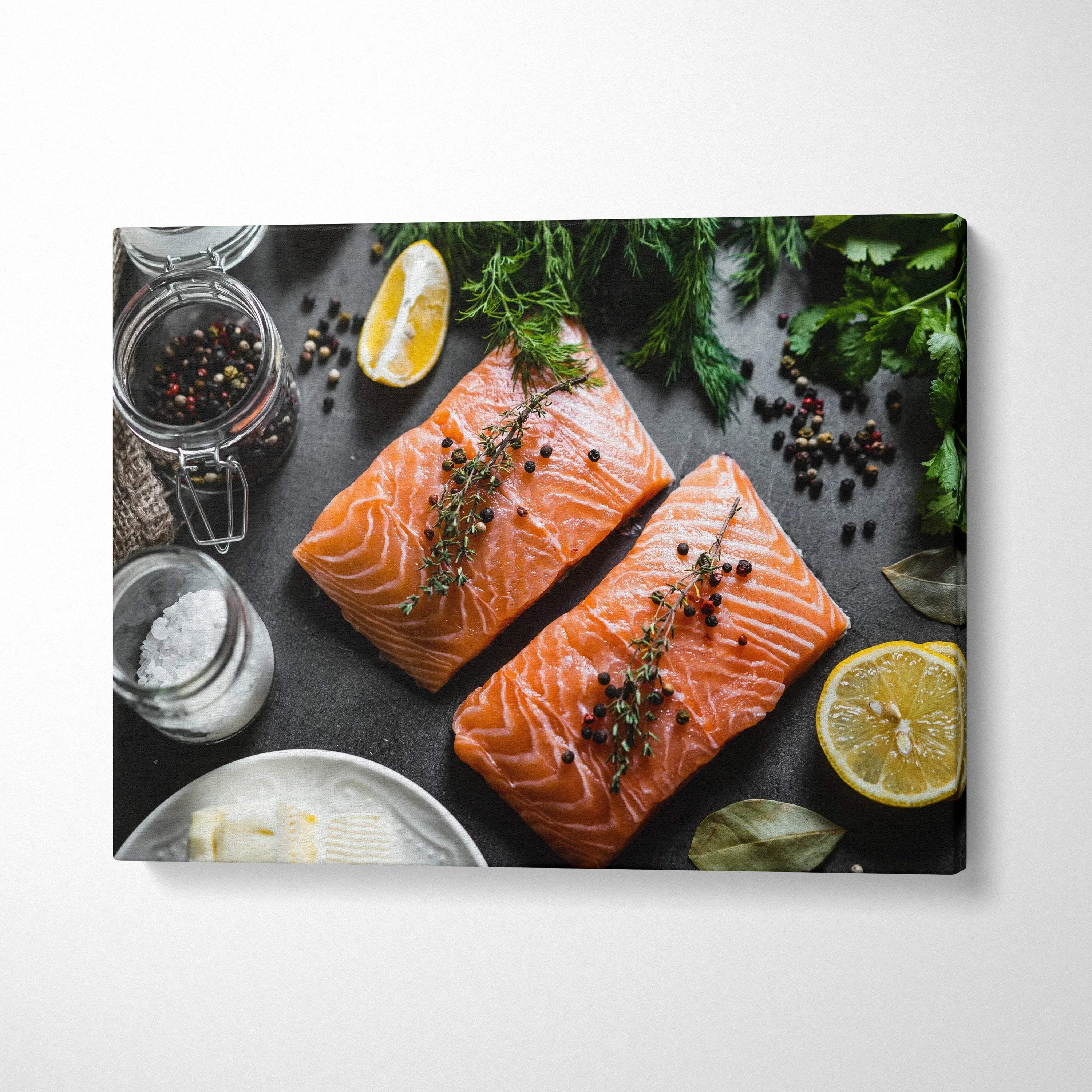 Canvas wall art featuring fresh salmon fillets with herbs, lemon slices, and spices on a dark surface for home decor.