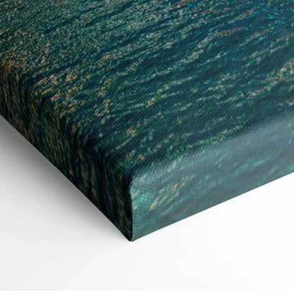 Close-up of canvas art corner showing textured teal and gold abstract architectural design on stretched fabric wall art.