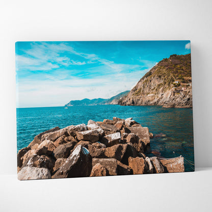 Canvas print of rocky coastline near Riomaggiore with turquoise water