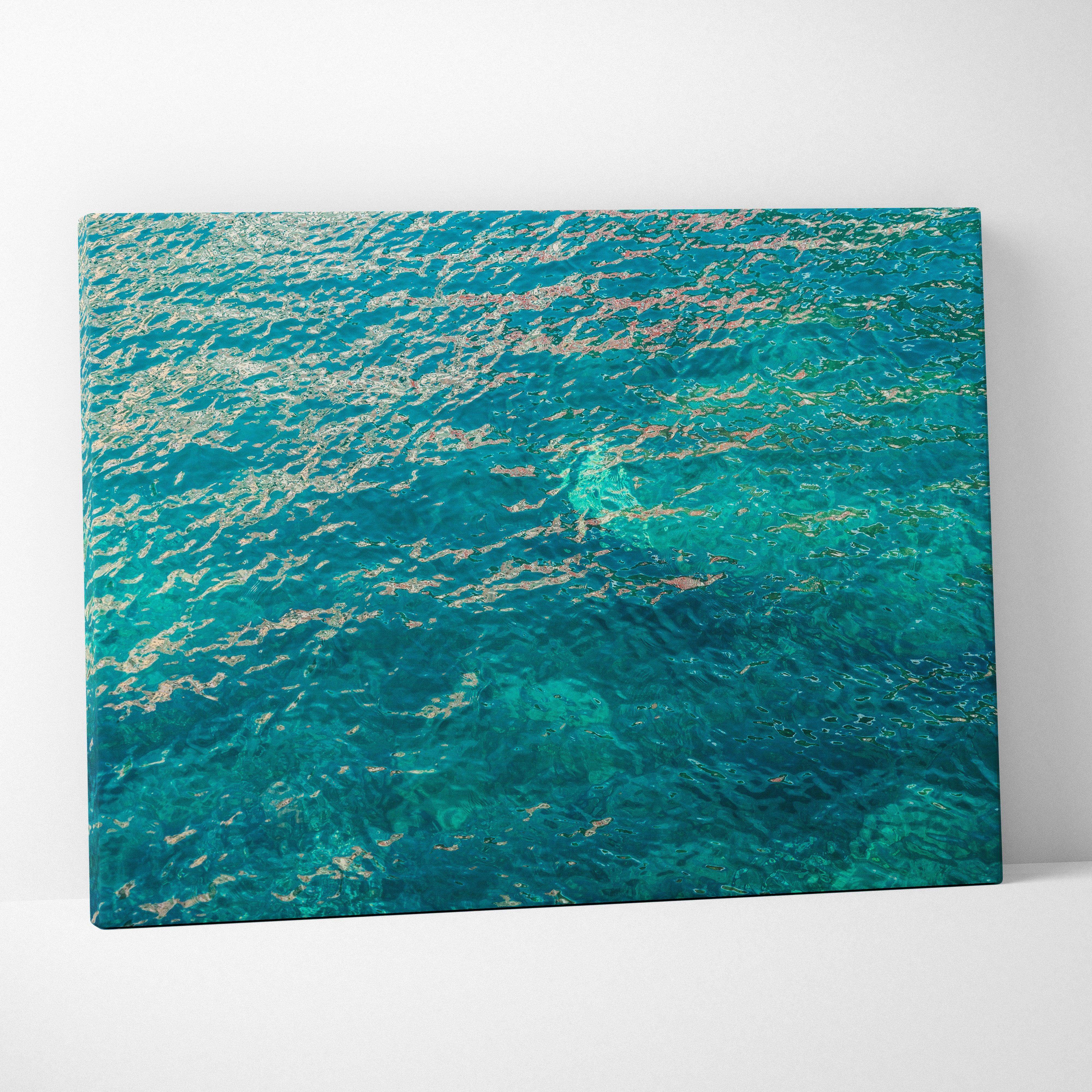 Vibrant turquoise ocean canvas print with shimmering gold reflections