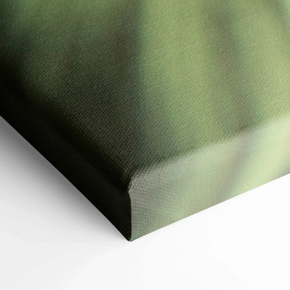 Close-up of canvas corner with green abstract floral design for wall art decor.