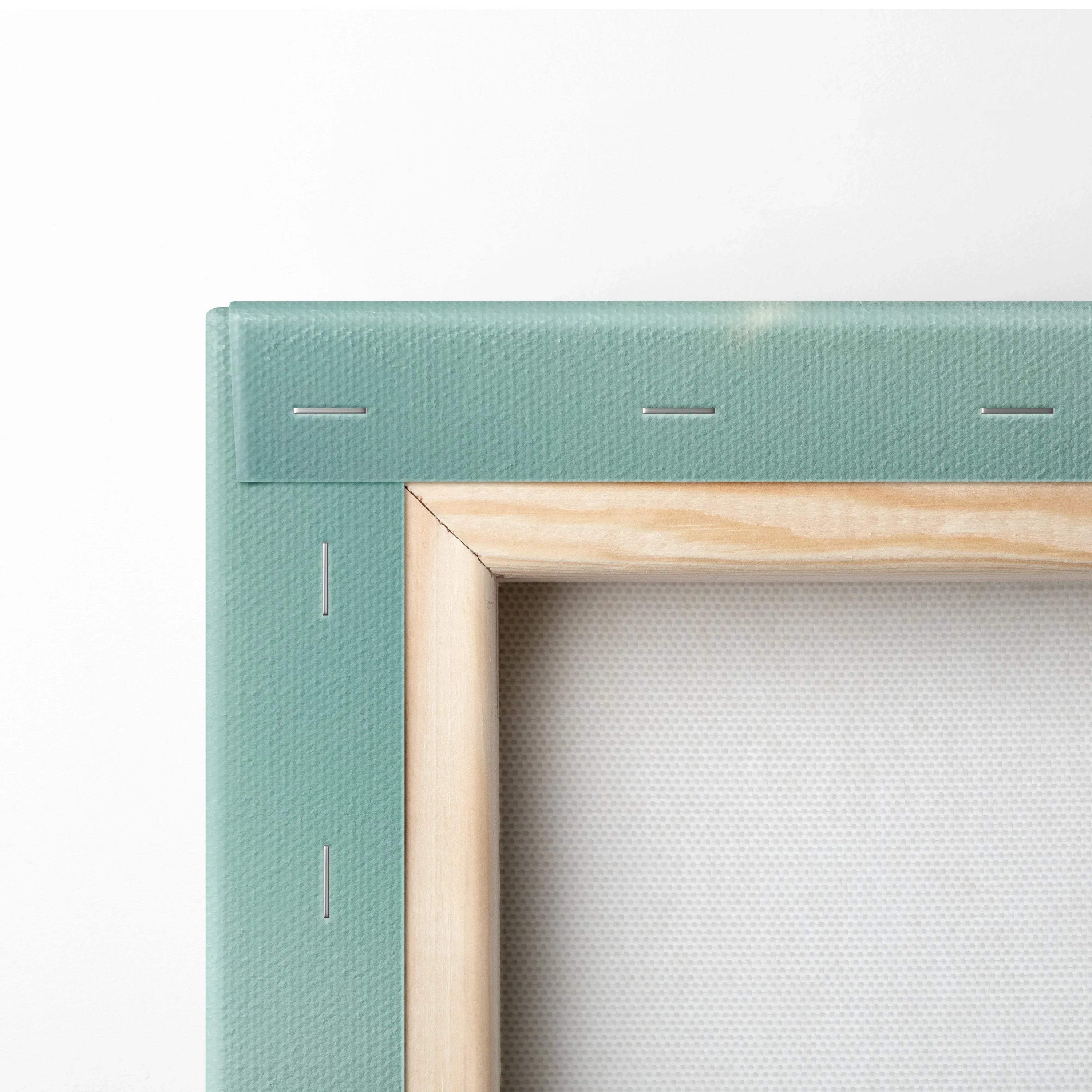 Close-up of wooden frame and light green canvas backing on floral wall art decor.