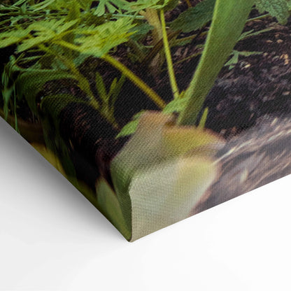 Close-up of canvas wall art with vibrant green leaves and delicate cherry blossom flowers in soft pink and white hues.