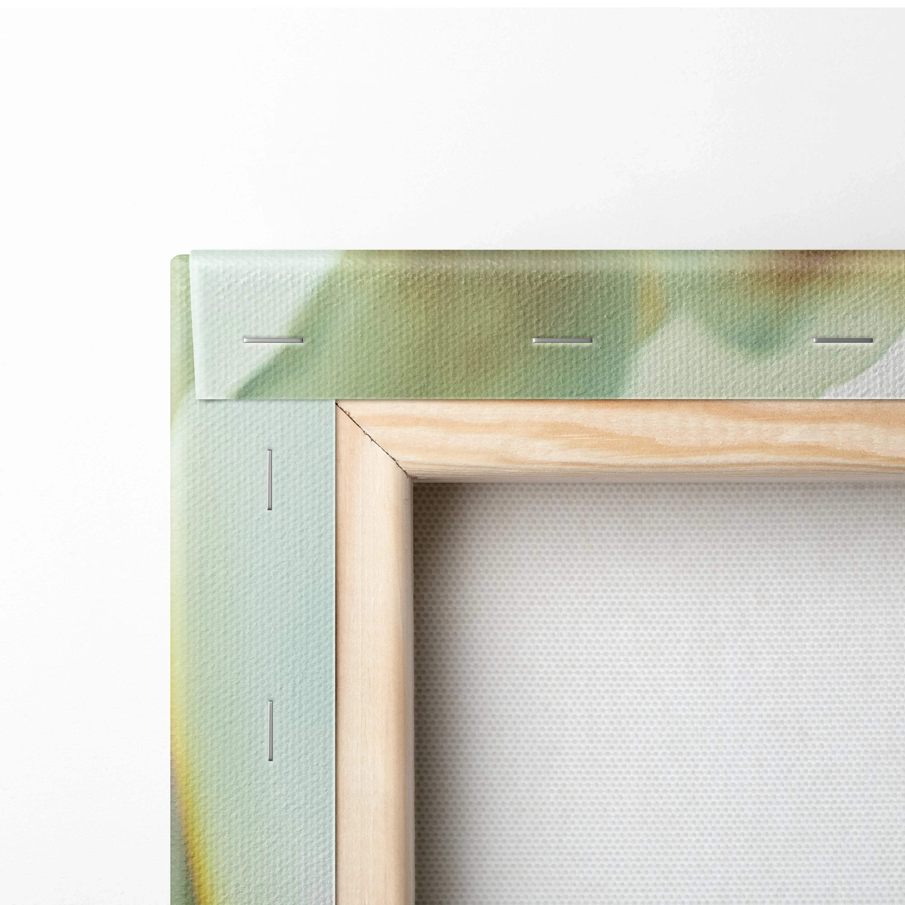 Close-up of wooden frame and stretched canvas with soft green and pink watercolor floral design on wall art decor.