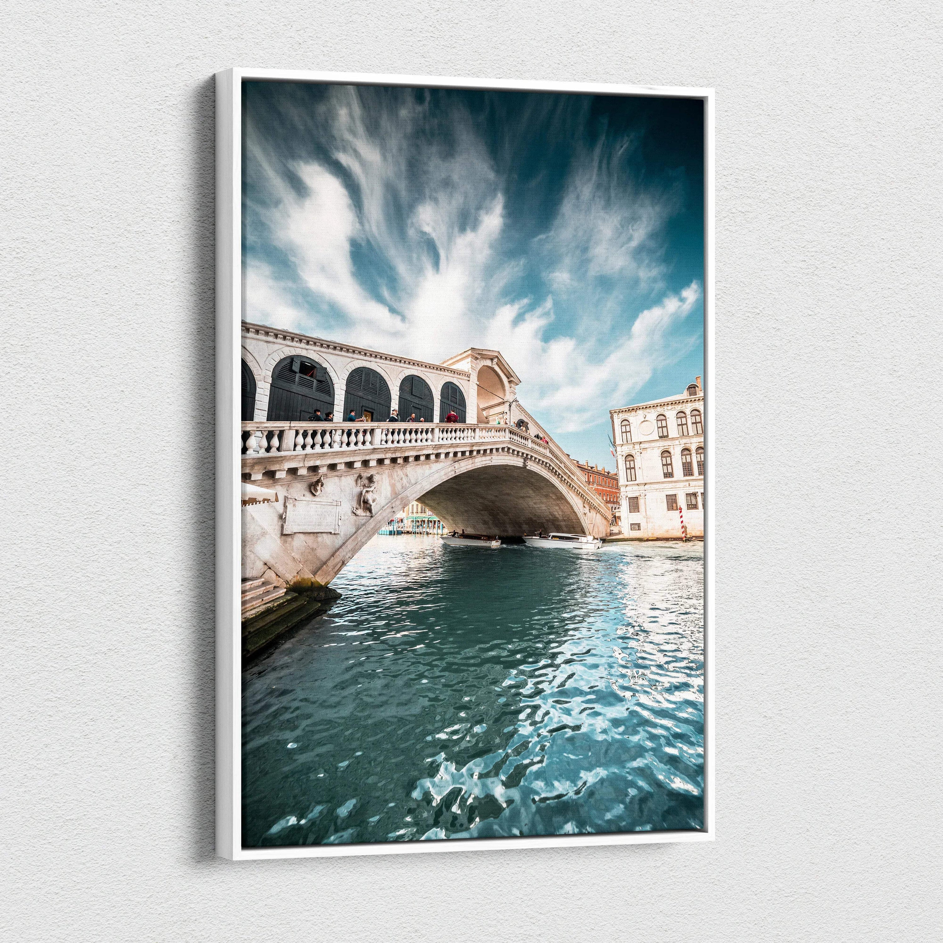 Canvas wall art featuring a bright blue sky and detailed stone bridge over sparkling water, showcasing iconic architecture.