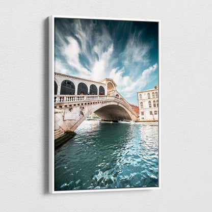 Canvas wall art featuring a bright blue sky and detailed stone bridge over sparkling water, showcasing iconic architecture.