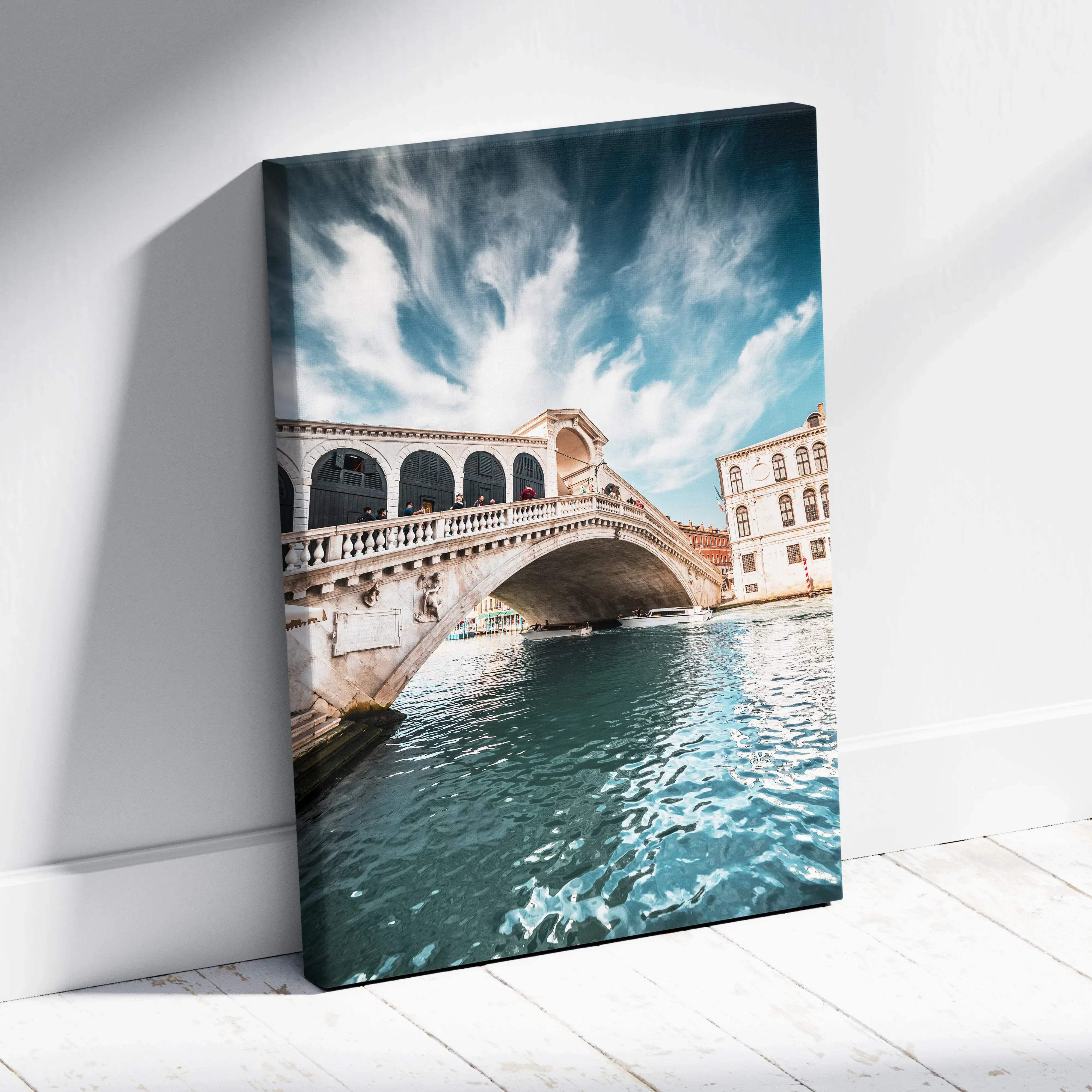 Canvas print of venice rialto bridge with vibrant blue sky turquoise water and warm stone tones fine art photography