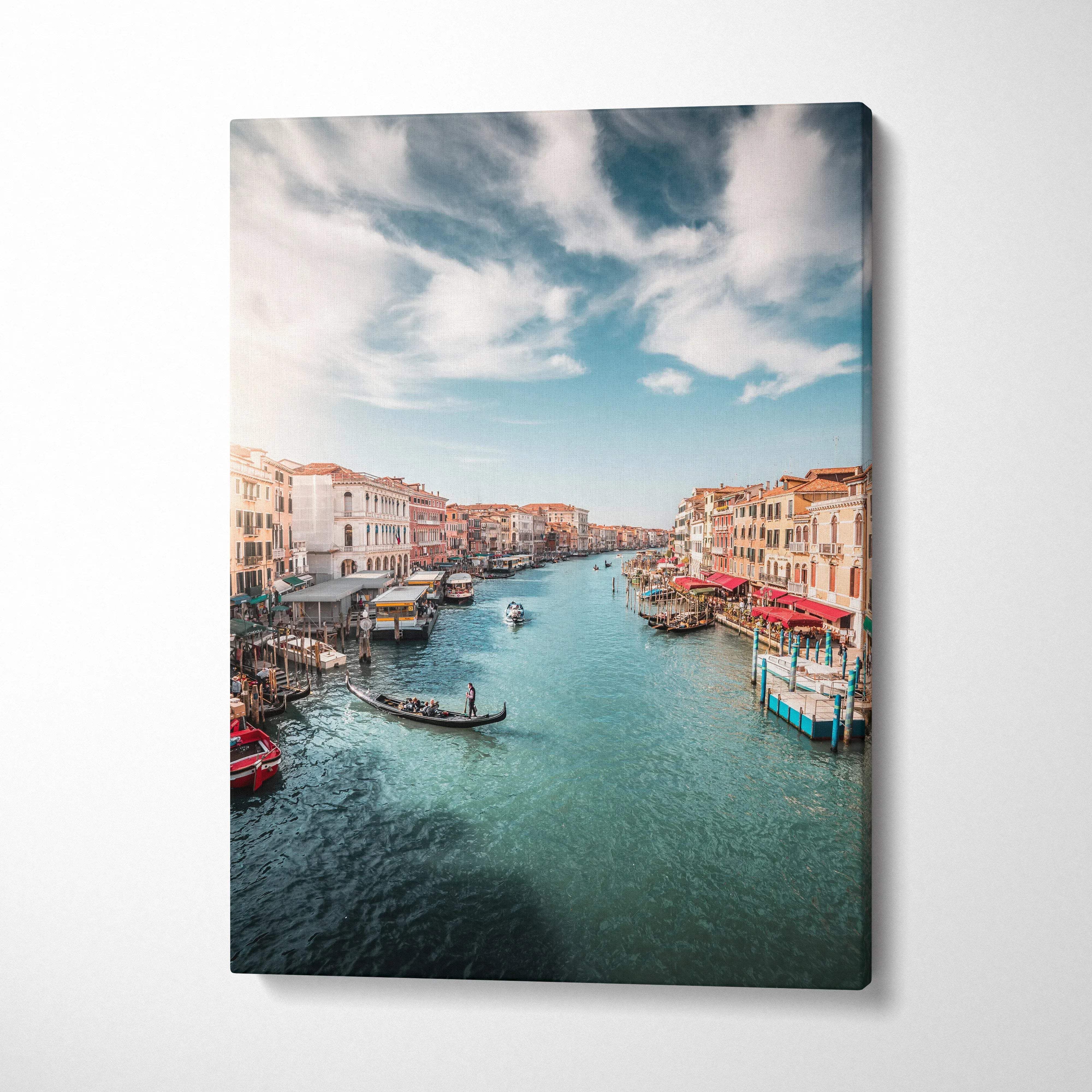 Canvas wall art featuring serene Venetian canal with boats and historic buildings under blue sky.