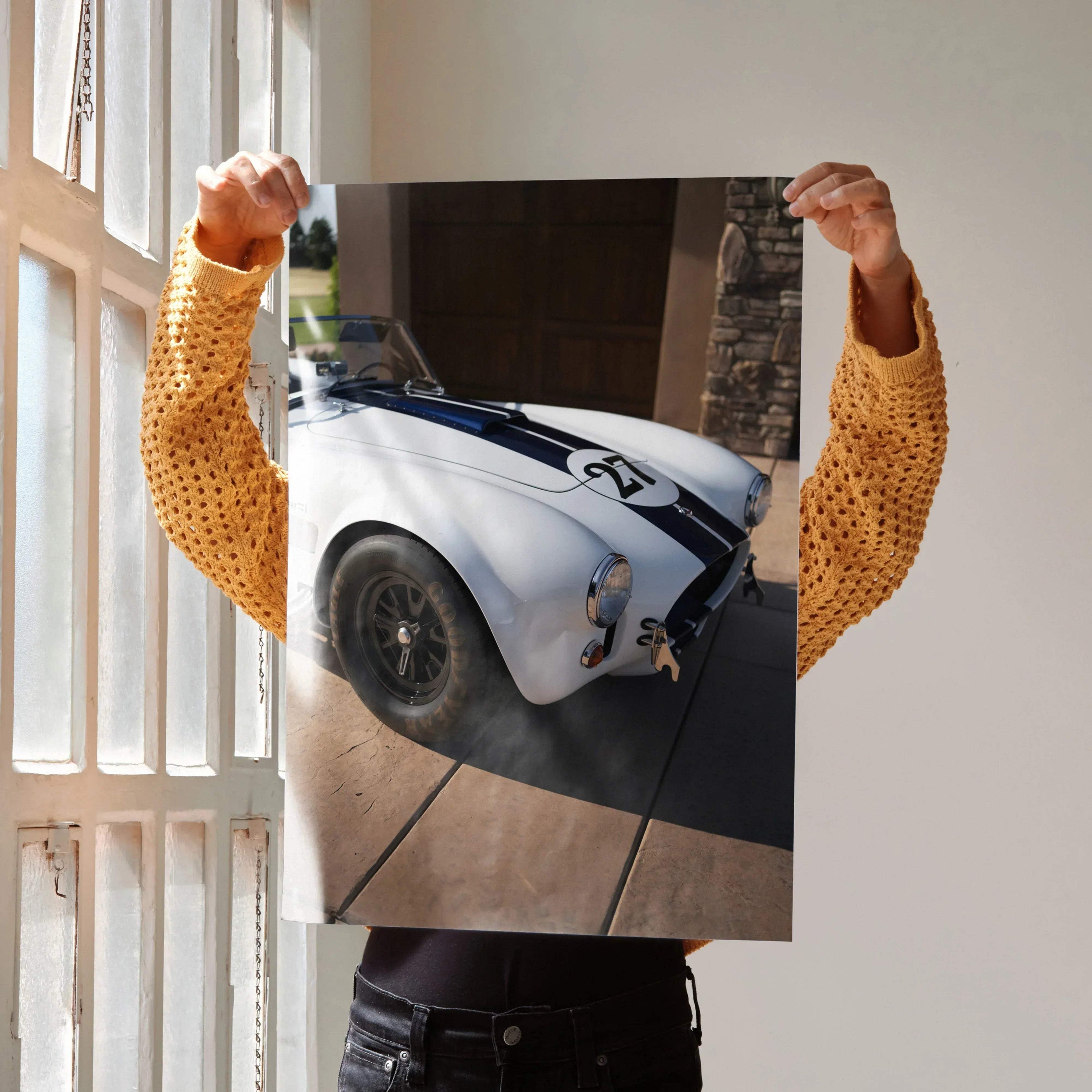 Shelby Cobra car close-up with white body and blue racing stripes poster wall art.