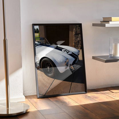 Shelby Cobra high-resolution car poster leaning against wall, glossy finish, modern wall art.