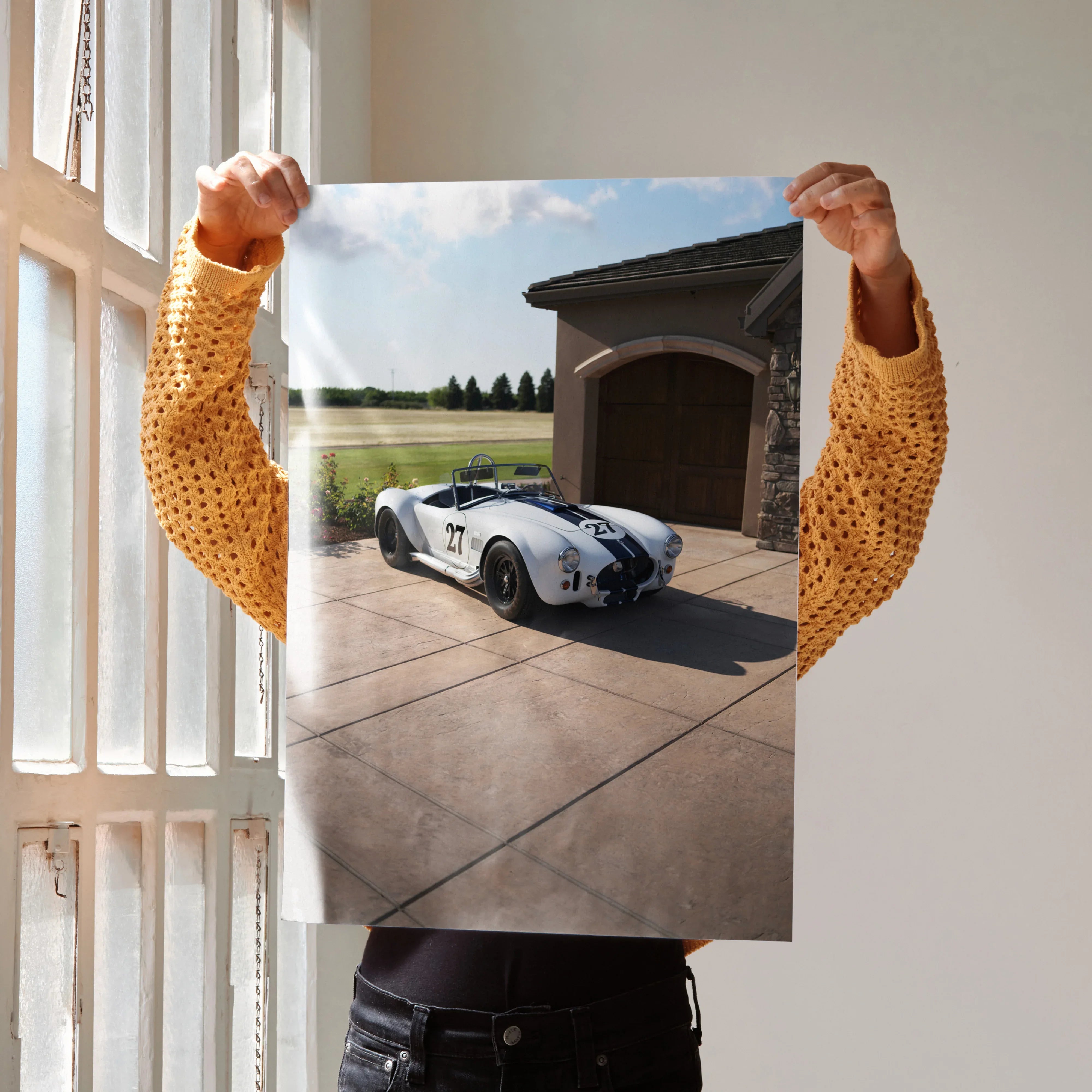 Shelby Cobra sports car poster showing blue and white classic car in driveway, wall art for car enthusiasts.