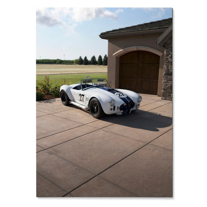 Shelby Cobra classic car parked on driveway outside garage with blue sky poster wall art.