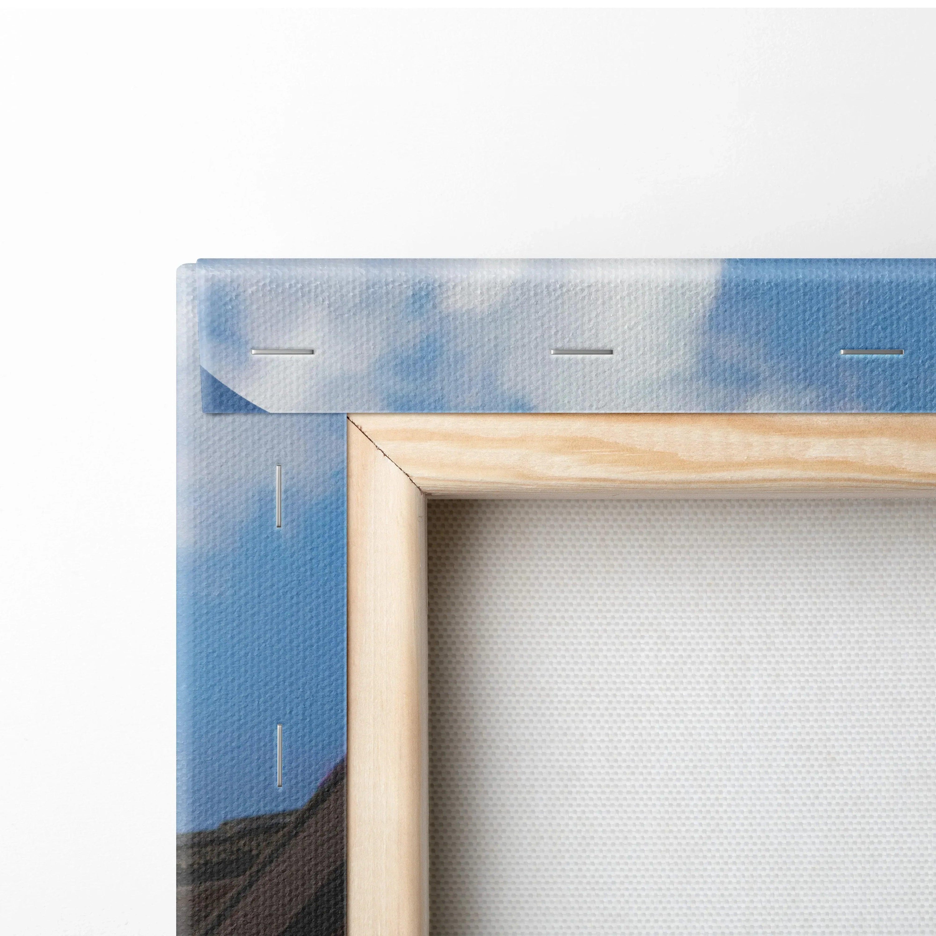 Corner detail of vertical Shelby Cobra canvas art with wooden frame and blue sky background.