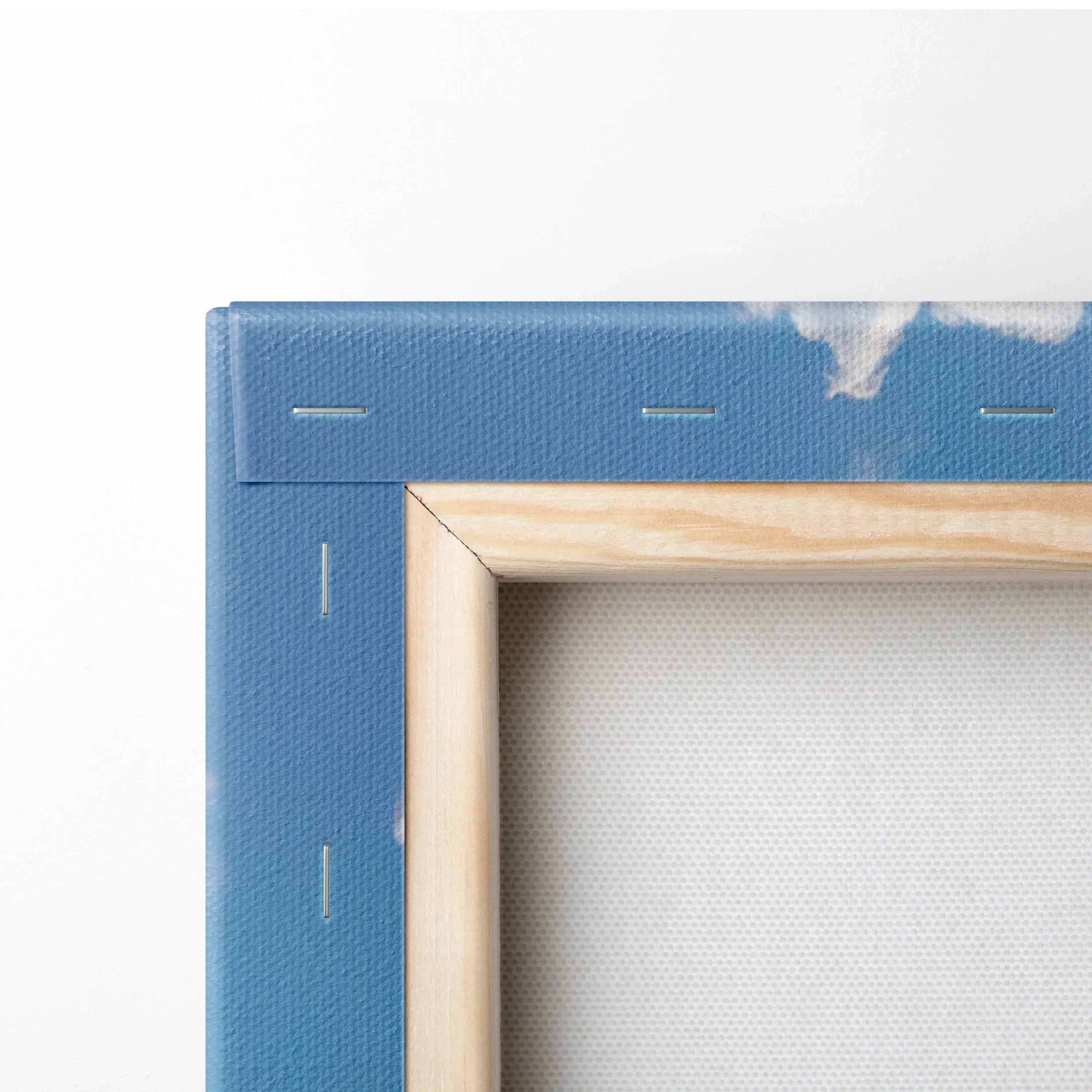 Close-up of wooden frame and blue canvas edge with white print, vertical canvas art wall decor.