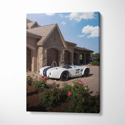 Shelby Cobra vintage race car parked by stone house in outdoor canvas wall art.