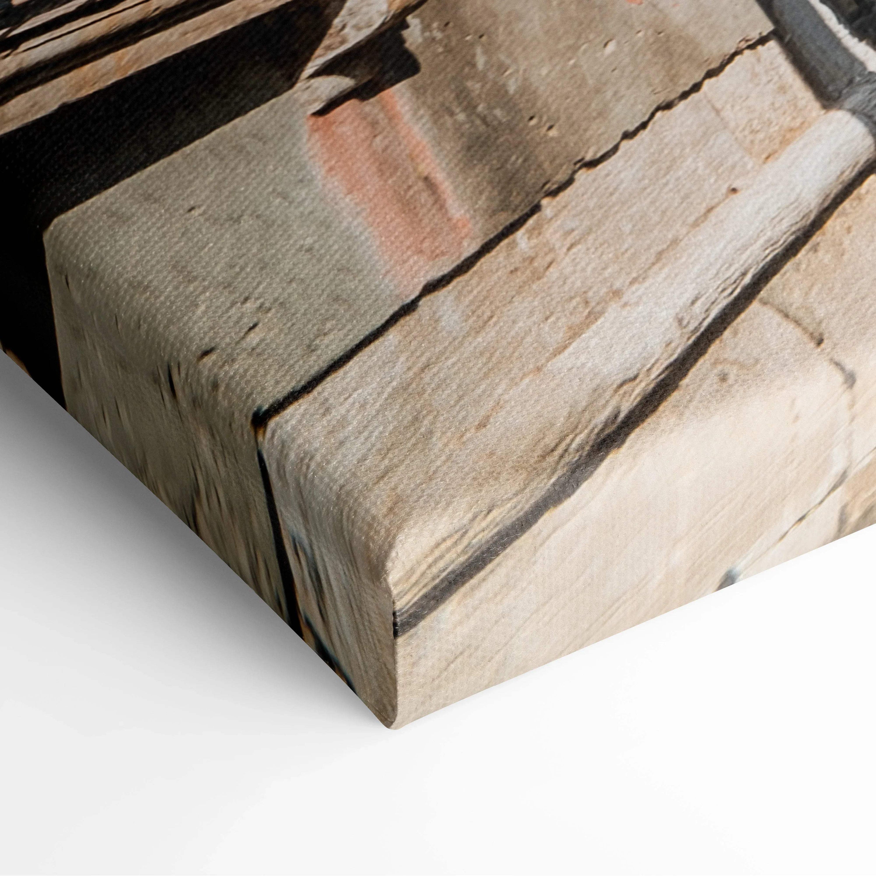 Close-up of textured canvas wall art featuring architectural detail with stone and brick textures in neutral tones.
