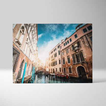High-resolution canvas wall art featuring a vibrant canal scene with historic buildings and bright blue sky.