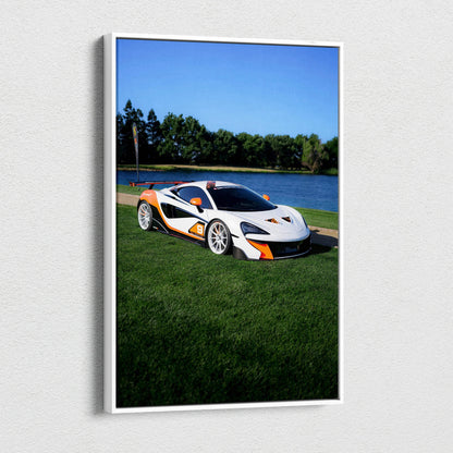 Vertical canvas wall art featuring a white McLaren 570S with orange accents on green grass by a lake.