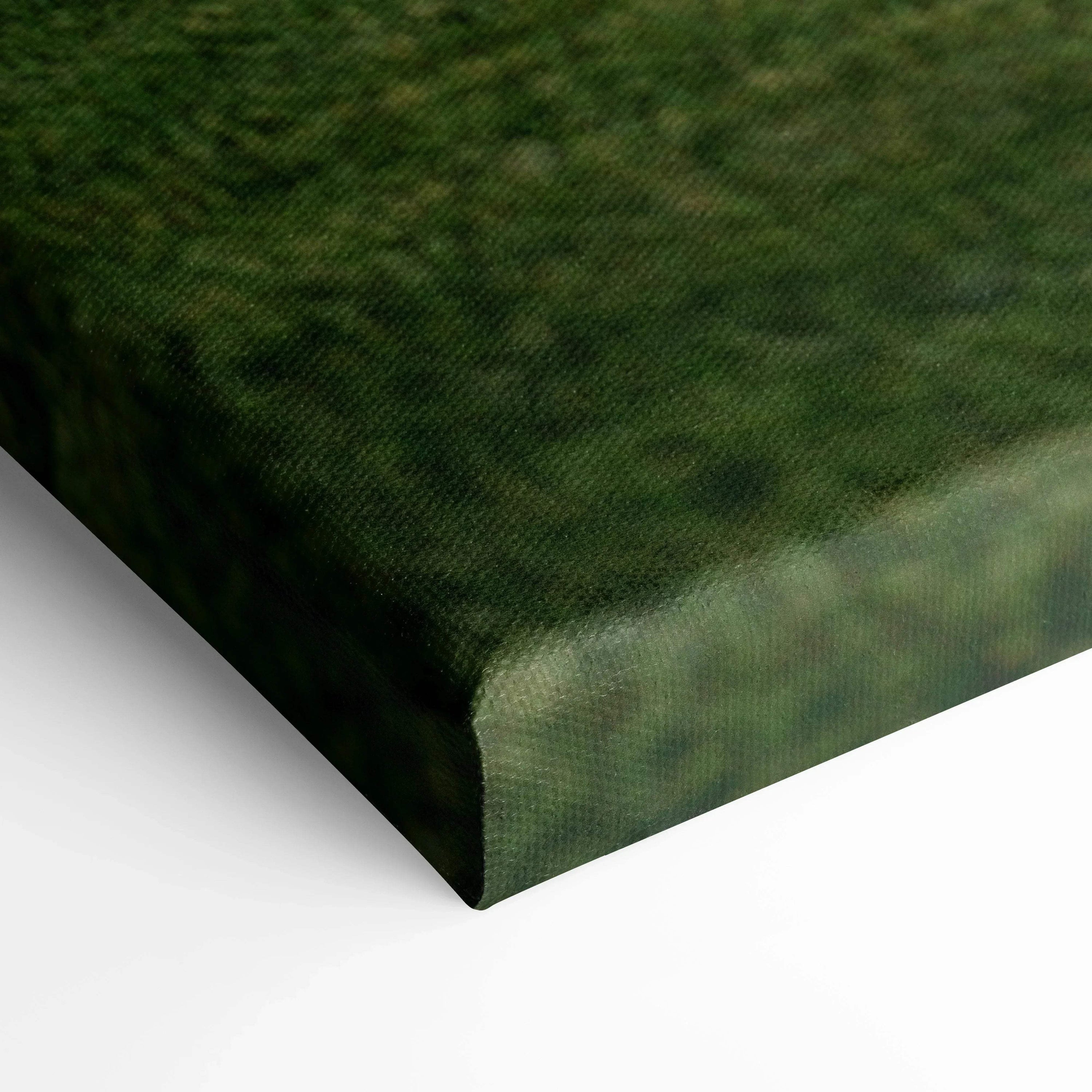 Close-up of textured canvas edge with green and black tones in vertical wall art print.