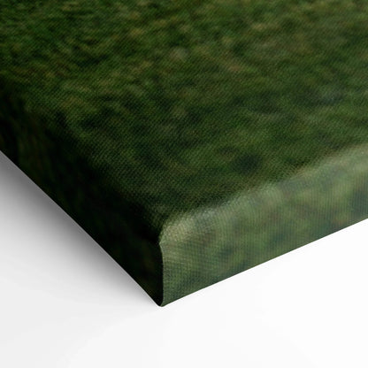 Close-up of textured canvas edge with green and black tones in vertical wall art print.