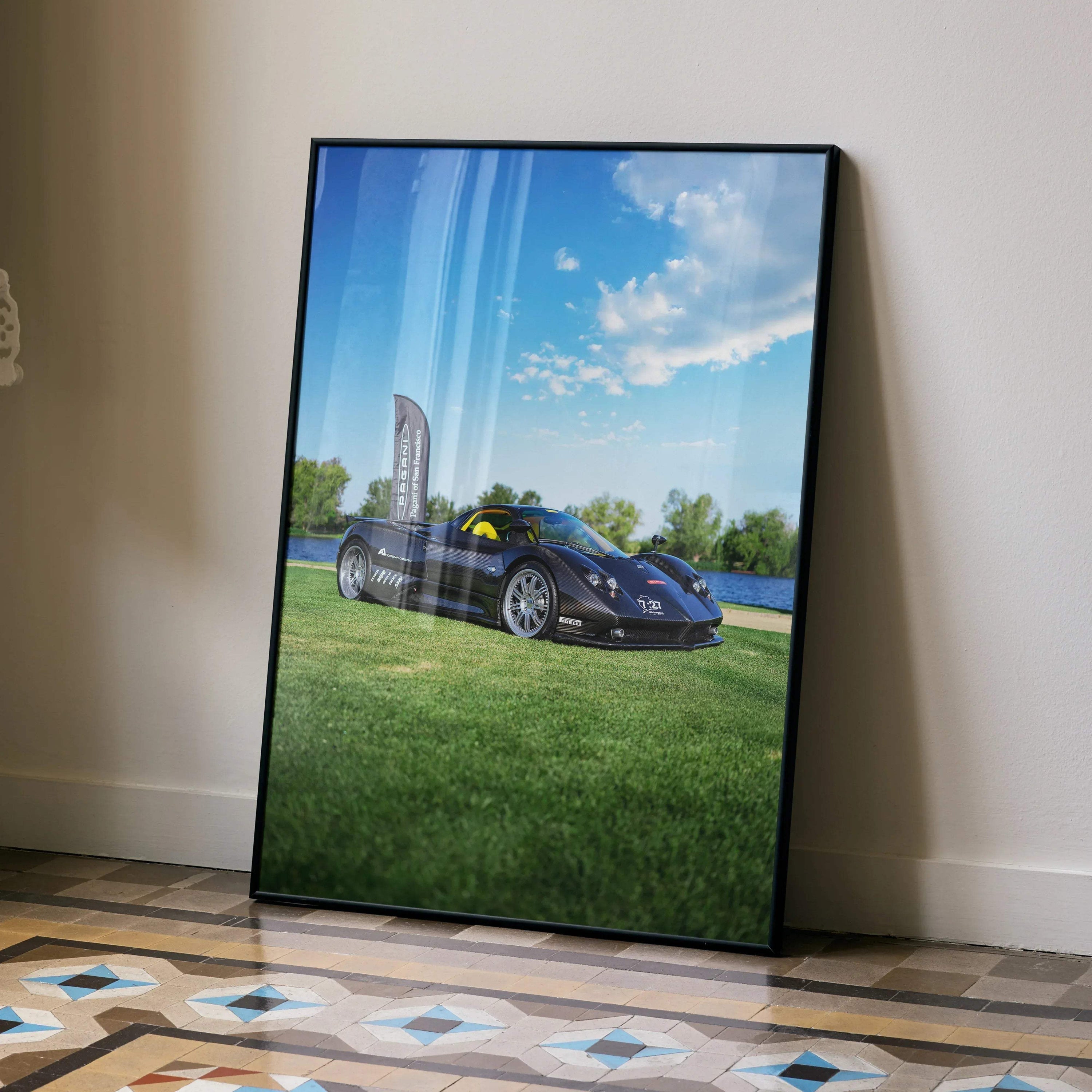 Pagani Zonda F Clubsport car poster with blue sky and green grass wall art in black frame.