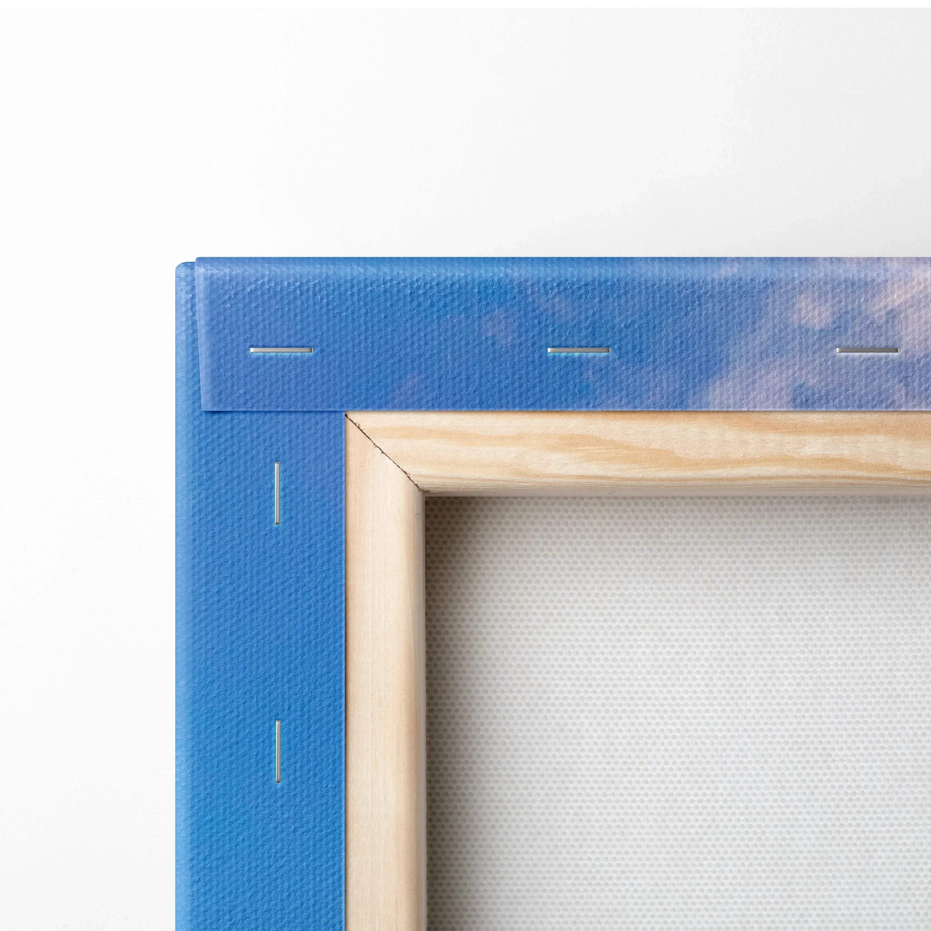 Blue stretched canvas corner with natural wood frame and visible staples for wall art mounting.