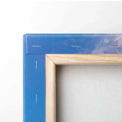Blue stretched canvas corner with natural wood frame and visible staples for wall art mounting.