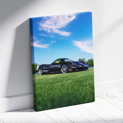 Pagani Zonda F Clubsport black sports car on grass under blue sky canvas wall art.