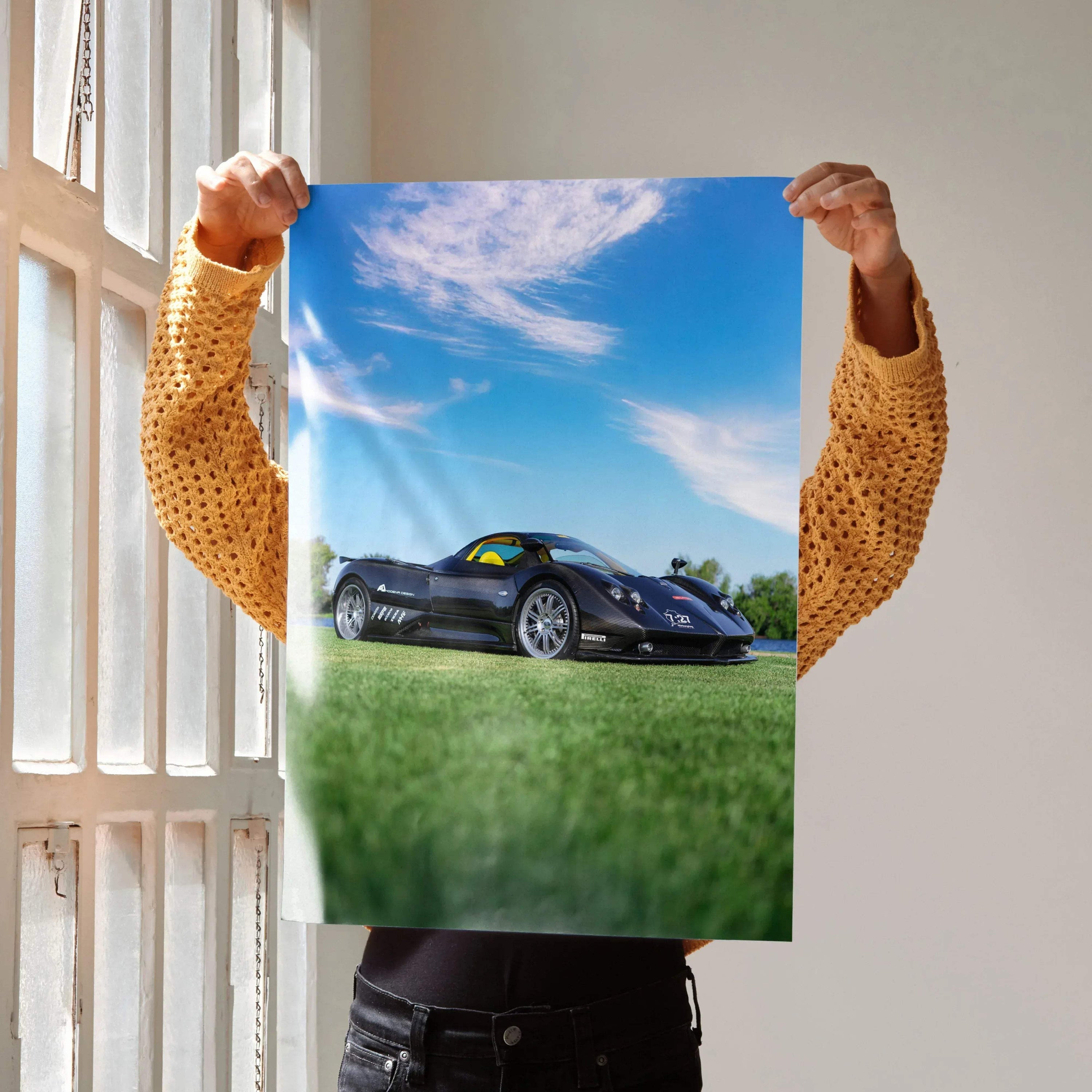 Pagani Zonda F Clubsport black car on grass under blue sky poster wall art.